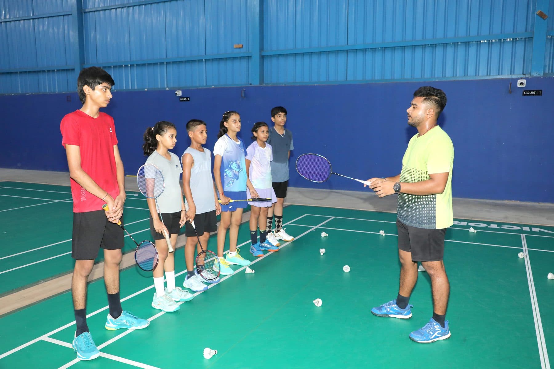 Coaching session with young players at Axon Badminton Academy Palanpur